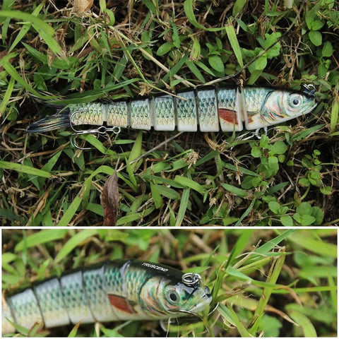 Easy Catch Three Action Swimbait Lure With BKK Hooks on grass, displaying articulated segments for wiggling.
