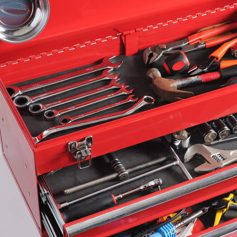Red tool chest with wrenches, hammer, pliers, and other tools, showing organized storage.