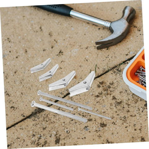 Heavy Duty Toggle Bolts And Wing Nut Kit For Drywall And Hollow Doors, 32 Piece Anchors And Screws Set With Reliable Butterfly Expansion For Hanging Heavy Items. silver toggle bolts, screws, and hammer on concrete