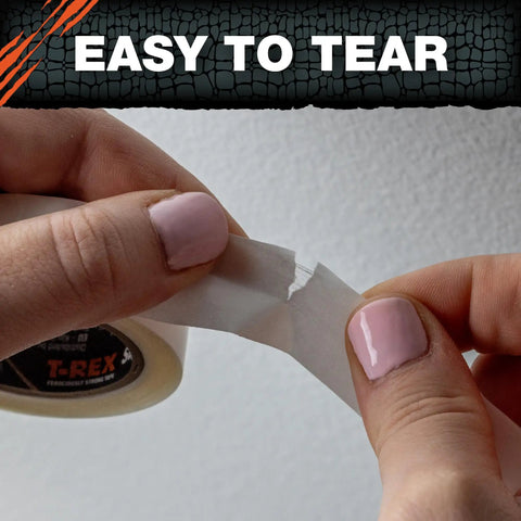 Hands tearing a piece of Heavy Duty Double Sided Super Glue Tape 0.75 Inches By 15 Yards Clear Acrylic Formula.