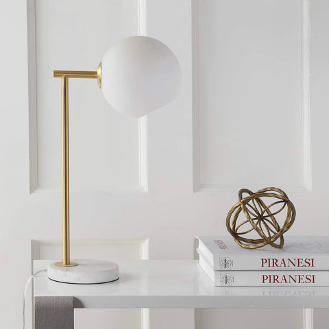 Gold And White Modern Metal Marble LED Bedside Lamp With Frosted Glass Globe Shade Sleek Minimalist Scandinavian Style For Bedroom And Living Room Includes Energy Saving LED Bulbs ETL Listed on a white table next to books
