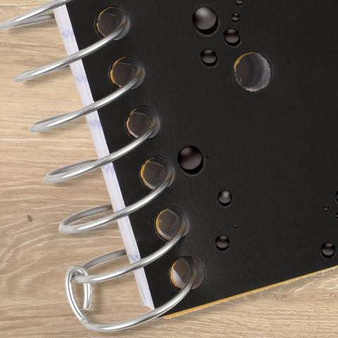 Hustle Ready Black Spiral Notebook With Five Subject Sections And College Ruled Paper providing clean lines, showing water-resistant cover detail.