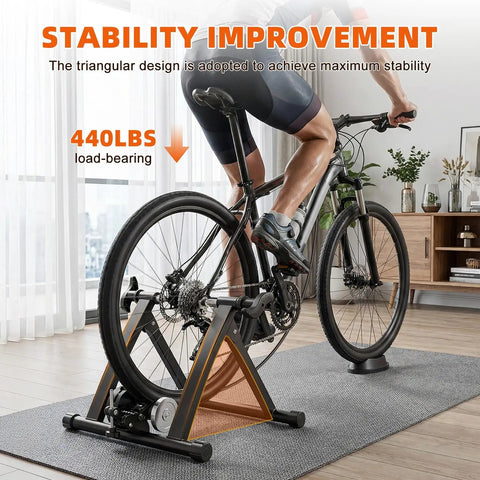 Cyclist using Indoor Bike Trainer Stand With Magnetic Resistance For Home Rides Fits 26 To 28 Inch And 700C Wheels in living room