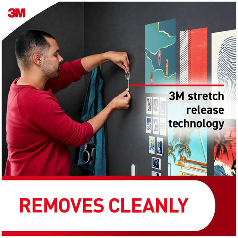 Person using Medium Clear Damage Free Hanging Hooks Set with Six Hooks and Clear Strips for Easy Clean Wall Mounts