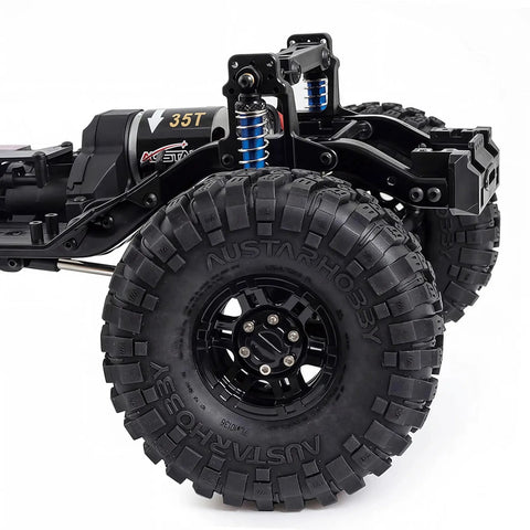 Close-up of One Tenth Scale RC Crawler Chassis Kit With 313mm Wheelbase, showcasing nylon frame, 35T motor, and rugged tires.