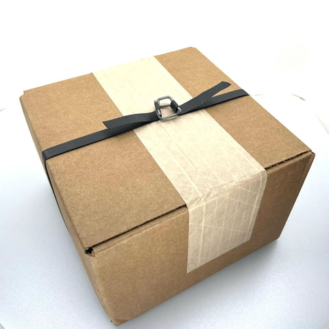 Box secured with Portable One Half Inch Polypropylene Strapping Kit With Mini Coil Tool And Buckles, 3000 Ft Of Poly Strapping