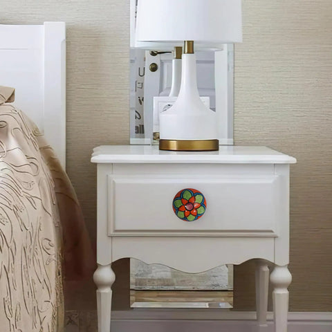 Snag These Dope Colorful Ceramic Drawer Knobs And Boho Cupboard Pulls To Quick Flip Your Kitchen Cabinets Or Dressers A Total Vibe Upgrade For Any Room Comes In A Twenty Piece Set on a white nightstand.
