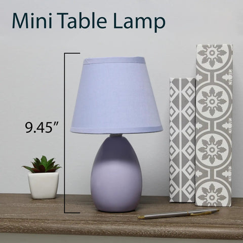 Super Cute Mini Blue Egg Oval Ceramic Table Desk Lamp With Matching Fabric Shade Perfect For Your Living Room Bedroom Office Kids Room Or College Dorm Space on a shelf.