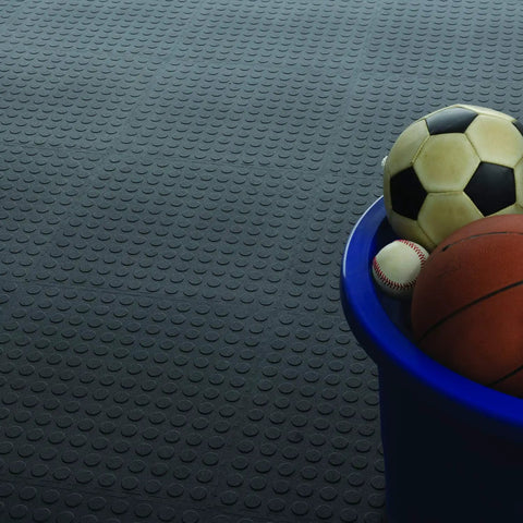 Interlocking 18 By 18 Inch Raised Coin Floor Tiles for Home Gym Garage Basement Black 24 Pack with sports balls on blue tub