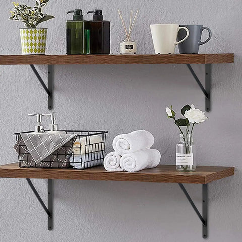 Twelve Pack Slick Matte Black Heavy Duty Angle Wall Brackets With Screws For Rustic Floating Shelves supporting towels and decor.