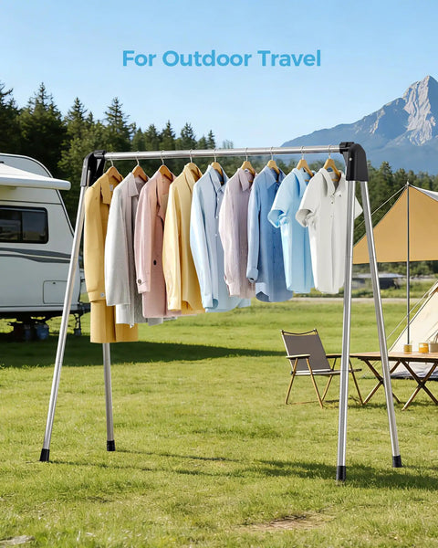 Foldable Clothes Drying Rack Portable Laundry Stand Sturdy Hanging Bars Compact Airer For Apartments Dorm Rooms Closets Quick Dry Setup Zero Fuss Easy Everyday Storage with colorful shirts outdoors