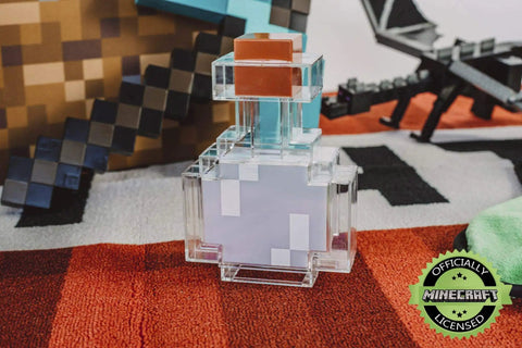 Potion Bottle Color Changing LED Desk Lamp With Pixelated Design in a gaming setup, showcasing its authentic pixel art decor.