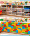 9 Foot Building Block Table Skirt Bringing Sweet Brick Vibes To Teachers Desks And Classroom Workstations For Back To School Setup And Quick Office Or Cabinet Decor Accents on a shelf with colorful blocks.