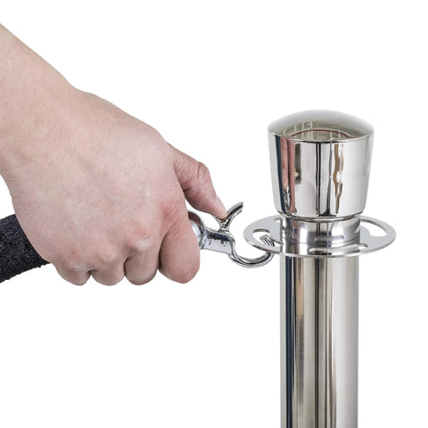 Hand attaching black velvet rope to U2140 Premier Chrome Post And Black Velvet Rope Crowd Control Stanchions For Event Barriers