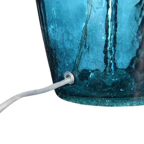 Cool Deep Blue Translucent Textured Glass Table Lamp With Cream Empire Shade And Brushed Chrome Accents cord entry detail