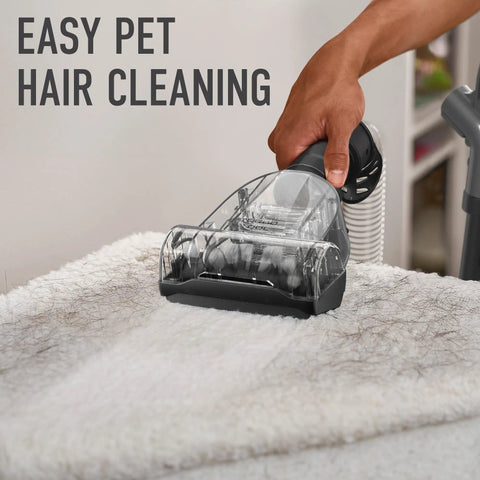 Hoover Rewind Pet Upright Bagless Vacuum Cleaner For Carpet And Hard Floors With Automatic Cord Rewind And Above Floor Cleaning Capability In Sleek Gray Finish cleaning pet hair from a soft carpet.