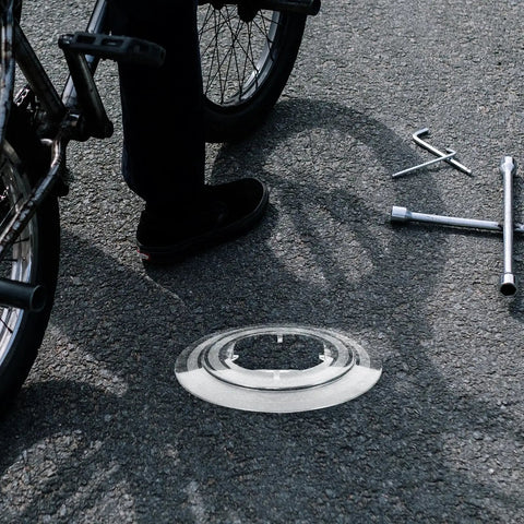 Chain Guard And Spoke Protector for Mountain and Road Bikes next to bike, transparent plastic, easy install