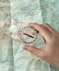 Oil Type Orienteering Compass II Trail Ready Waterproof With Magnifier Loupe 0.8 Inch 80mm Ruler Rotating Dial in use on map