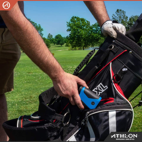 Slope Smart Golf Rangefinder Locks Down Fairway Distances Up To Eight Hundred Yards Handles Hilly Terrain Smoothly And Delivers Ball Park Precision For Weekenders Available In Sleek Blue For Reliable Courseplay in a golfer's hand, ready to use.