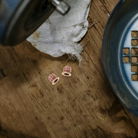 M6x10mm Countersunk Flange Wood Nut Inserts For Cabinets And Desks on wooden surface, carbon steel finish, close-up view