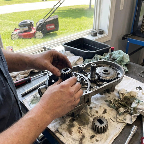 Person installing 2 Pack Pinion Gears 1315399 For 22 Inch Recycler And Personal Pace Lawn Mowers Replacement 1109417