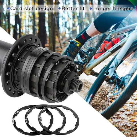 Seven Piece Grooved Hub Washer Set for Bikes, Cassette Spacers and Flywheel Headset Spacers, 7 Thickness Options beside bicycle