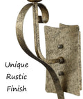 Close-up of Rustic Wall Sconce Vanity Light with amber glow glass shade and rubbed bronze finish, showing unique rustic metal texture.