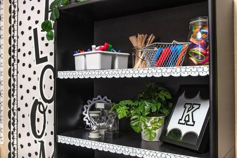 Squiggles And Dots Magnetic Border For Whiteboards And Metal Surfaces on a decorated classroom shelf.