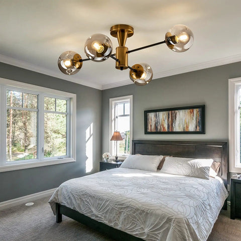 Modern Four Light Gold Glass Globe Ceiling Light Fixture Mid Century Semi Flush Mount in bedroom setting