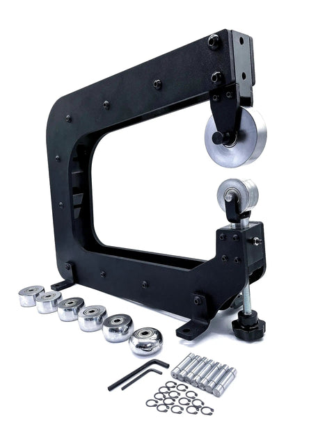 Real Deal Mini English Wheel Featuring 15 Inch Throat Depth And Seven Piece Anvil Wheel Set, showing metal forming components and accessories.