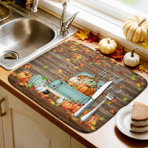 Thanksgiving Dish Drying Mat Set For Kitchen Counter, Pumpkin Harvest Maple Leaf Wood Grain Design next to sink with pumpkins