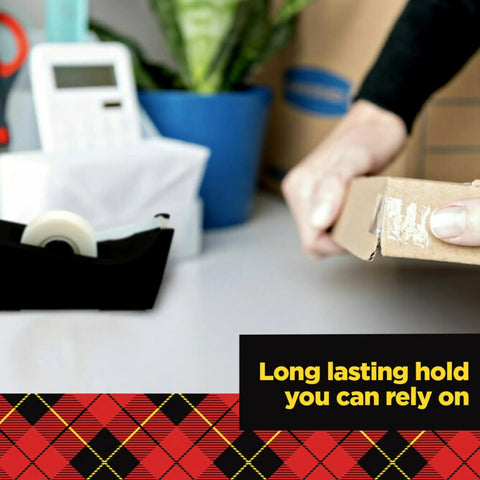Crystal Clear Tape For Office And Home Use Three Quarter Inch Wide By 1000 Inches Long Pack Of 12 Rolls in a tape dispenser on desk