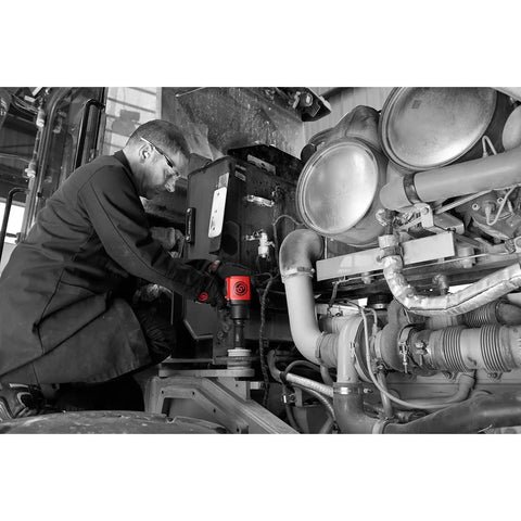 Built Tough Three Quarter Inch Air Impact Wrench With Comfort Pistol Grip Dishes Out One Thousand Four Hundred Foot Pounds Peak Reverse Torque And Six Thousand Five Hundred Quick Revs For Real World Repair Jobs in use by a technician.
