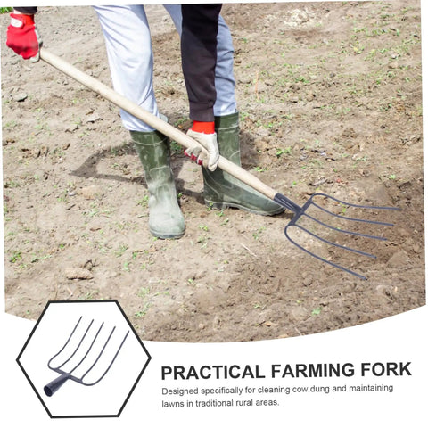 Heavy Duty Iron Manure Fork For Lawn Maintenance And Mulch Clearing Handheld Garden Tool With Five Teeth Design Rugged Yard Work Tool For Rural Areas Easy Grip Handle Efficient Manure Removal And Mulching in use on soil with person in boots
