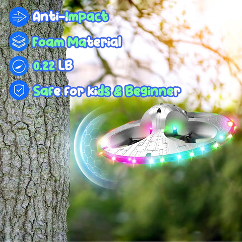 UFO Drone For Kids With Colorful LED Lights flying near tree, showcasing anti-impact foam build and safe design for beginners.
