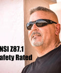 Man wearing Tough As Nails Safety Glasses With Super Dark Lenses ANSI Z87 1 Certified in outdoor setting.