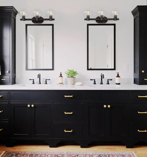 Modern Farmhouse 3 Light Vanity Light Industrial Wall Sconce With Clear Glass Globe Shade mounted above bathroom mirrors