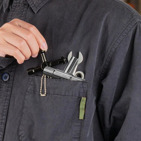 Person holding 4 Way Sillcock Water Key, All In One Steel Tool For Sillcocks Faucets Valves And Spigots, pocket view