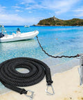 Elastic Bungee Dock Line For Boat Mooring 14 Ft Rope With 316 Stainless Steel Clips in use on beach with boat moored