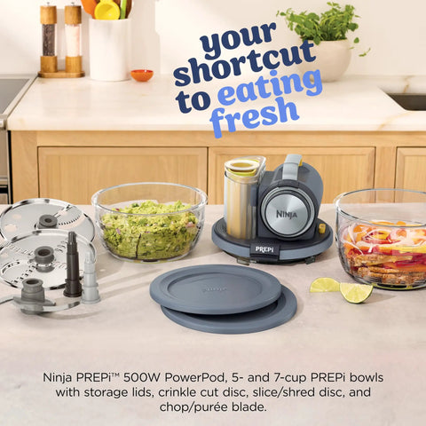 5 In 1 Kitchen Prep And Storage Bowl System Featuring Crinkle Slice And Shred Blades For Real Deal Meal Prep And Hosting Like A Champ With Secure Snap Lids on kitchen counter with bowls and processor.