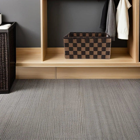 Top Shelf Clothing Storage Bin With Reinforced Metal Frame And Grippy Polyester Weave Handles on wood shelf with gray carpet.