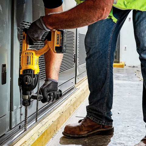Professional Heavy Duty Cordless Rotary Hammer Drill With D Handle And One Inch Chuck being used on a concrete surface.
