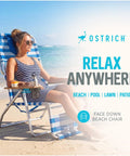 Woman relaxing on a 3N1 Lightweight Beach Reclining Lounge Chair with Footrest, blue stripe, at the beach with open face cavity.