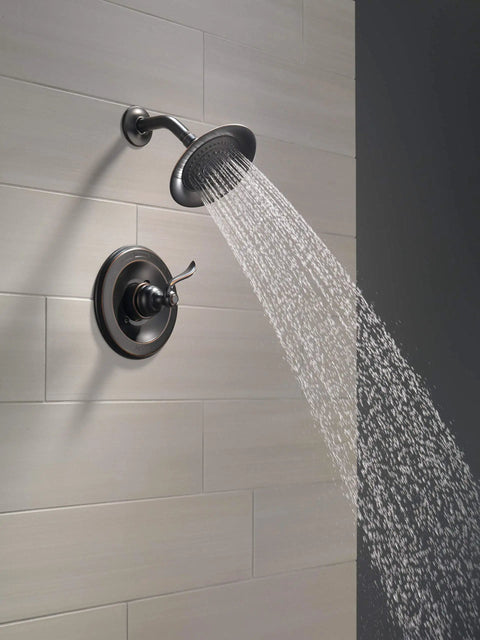 Windemere 14 Series Shower Faucet Set In Oil Rubbed Bronze With Shower Head And Handle Trim Kit spraying water on tiled wall