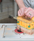 Person using Grr-Rip Block 3D Pushblock System for Table Saws, Smart Pushblock with Gravity Heel on a woodworking router table.