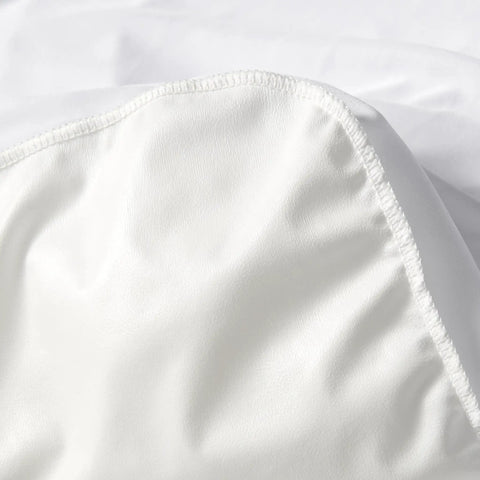 Queen Size Waterproof Mattress Protector With Full Bed Bug Proof Shield Snug Elastic Bands Secure Fit Keeps The Bed Drip Free All Night Long For Hassle Free Rest In Crisp White close-up of soft white fabric edge with elastic.