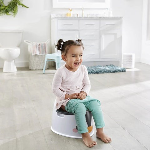 Happy toddler on Nifty Toddler Potty Training Seat With A Cool Penguin Face, enjoying bathroom time with a playful design.