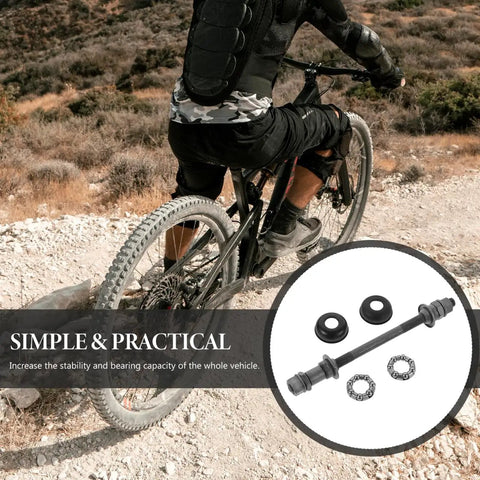Cyclist on rocky trail with 180mm rear bicycle axle components for mountain bikes, grey steel hub designed for 26 inch wheels.