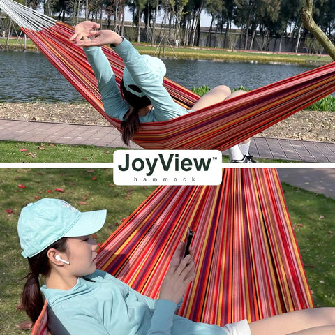 Person relaxing in a Brazilian Double Hammock With Extra Large 86 By 59 Inches Super Comfy Cotton Polyester Canvas For Patio