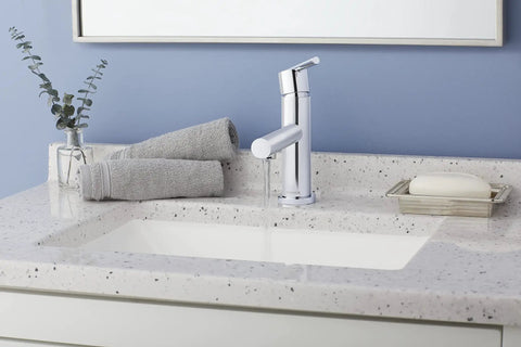 Parma Single Handle Lavatory Faucet With Metal Touch Down Drain on speckled countertop with modern bathroom decor